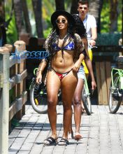 Socialite Angela Simmons shows off her bikini body as she enjoys a dip in the ocean on March 25, 2015 in Miami, Florida.
