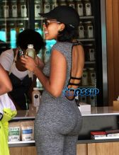 Socialite Angela Simmons stops by a juicery in Beverly Hills, California to purchase some fresh juice with a friend on April 14, 2015. Angela was rocking some grey tights which showed off her curvaceous figure.