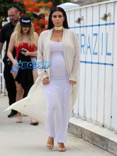 Kim Kardashian baby bump white dress lunch Do Brazil St. Barts Khloe Kardashian in the background