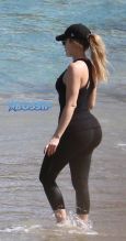 Khloe Kardashian shows off huge butt during beach workout in st. barths