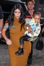 Pregnant Kim Kardashian West mustard dress North silk bomber black boots bun baby bump big butt NYC AKM-GS