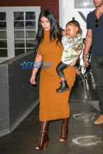 Pregnant Kim Kardashian West mustard dress North silk bomber black boots bun baby bump big butt NYC AKM-GS