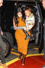 Pregnant Kim Kardashian West mustard dress North silk bomber black boots bun baby bump big butt NYC AKM-GS
