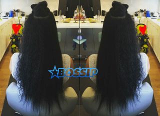 Kimora Lee Simmons shows off her long naturally curly hair while getting it styled Sunday Instagram