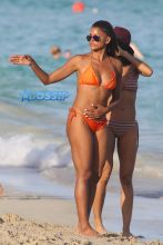 AKM-GSI Model Claudia Jordan, 42, actress Annie Ilonzeh, 32, bikini bodies in Miami Beach New Years day.