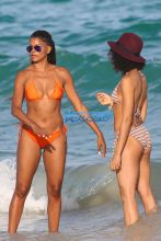 AKM-GSI Model Claudia Jordan, 42, actress Annie Ilonzeh, 32, bikini bodies in Miami Beach New Years day.