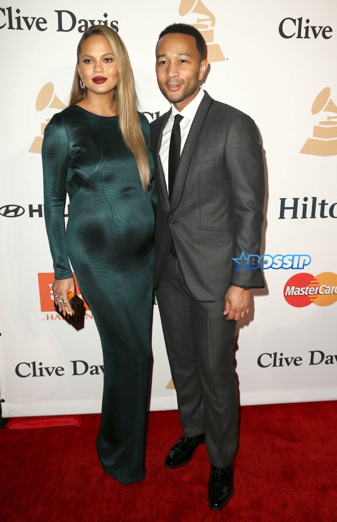 Chrissy Teigen, left, and John Legend arrive at the 2016 Clive Davis Pre-Grammy Gala at the Beverly Hilton Hotel on Sunday, Feb. 14, 2016, in Beverly Hills, Calif. (Photo by John Salangsang/Invision/AP)