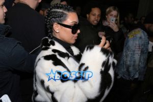 AKM-GSI Kim Kardashian NYFW Cruella De Vil Inspired Fur Coat Black and White Cornrows Cleavage