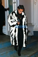AKM-GSI Kim Kardashian NYFW Cruella De Vil Inspired Fur Coat Black and White Cornrows Cleavage