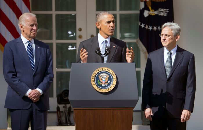 Federal appeals court judge Merrick Garland, right, stands with President Barack Obama and Vice President Joe Biden as he is introduced as Obama's nominee for the Supreme Court during an announcement in the Rose Garden of the White House, in Washington, Wednesday, March 16, 2016. (AP Photo/Pablo Martinez Monsivais)
