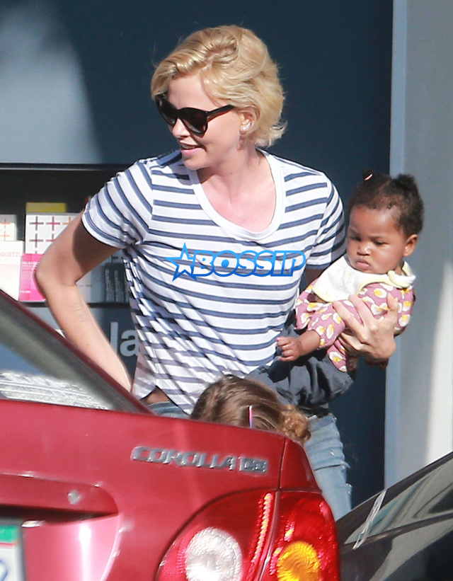 FameFlynetPictures Charlize Theron takes her kids Jackson and August out for ice cream in Hollywood, California on February 29, 2016.