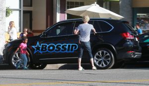 FameFlynetPictures Charlize Theron takes her kids Jackson and August out for ice cream in Hollywood, California on February 29, 2016.