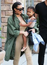 FameFlynetPictures Kim Kardashian West North West wear matching braids nude jumpsuits Encino