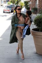 FameFlynetPictures Kim Kardashian West North West wear matching braids nude jumpsuits Encino