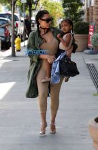 FameFlynetPictures Kim Kardashian West North West wear matching braids nude jumpsuits Encino