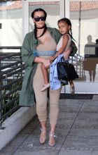 FameFlynetPictures Kim Kardashian West North West wear matching braids nude jumpsuits Encino