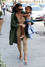 FameFlynetPictures Kim Kardashian West North West wear matching braids nude jumpsuits Encino