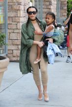 FameFlynetPictures Kim Kardashian West North West wear matching braids nude jumpsuits Encino