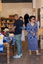 AKM-GSI wife Grace Miguel and Usher shop for children's clothes at Trico Field in Beverly Hills