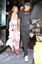 Beyonce and Jay Z are dinner date at Del Posto restaurant in New York City. Beyonce in a black leather jacket over a pink and white floral print dress; while Jay-Z dressed comfortably in a 'Greatness Is A Process' graphic tee, track pants and a black cap. AKM-GSI