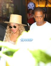 Jay Z and Beyonce leave their midtown office for his niece's graduation party. yellow pants white top white blazer straw hat and yellow handbag. AKM-GSI 27 MAY 2016