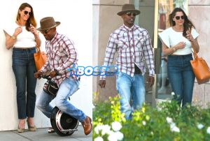 Jamie Foxx playing around toy motor bike Lil Go-Go. mystery woman relationship with Katie Holmes. plaid button up paired, camel boots and a hat. AKM-GSI