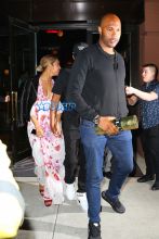 Beyonce and Jay Z are dinner date at Del Posto restaurant in New York City. Beyonce in a black leather jacket over a pink and white floral print dress; while Jay-Z dressed comfortably in a 'Greatness Is A Process' graphic tee, track pants and a black cap. AKM-GSI