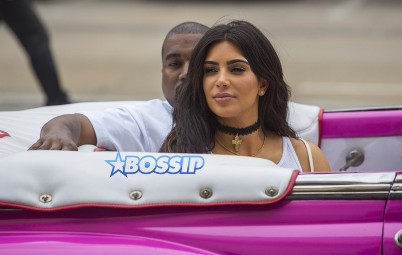 Kim Kardashian West sits in a classic convertible car with her husband Kanye West and her sister Kourtney Mary Kardashian, right, in Havana, Cuba, Wednesday, May 4, 2016. They visited Havanaís Museum of Rum Wednesday, stepping out of a hot-pink antique American convertible as they snapped selfies and were recorded by a television crew following them around.(AP Photo/Desmond Boylan)