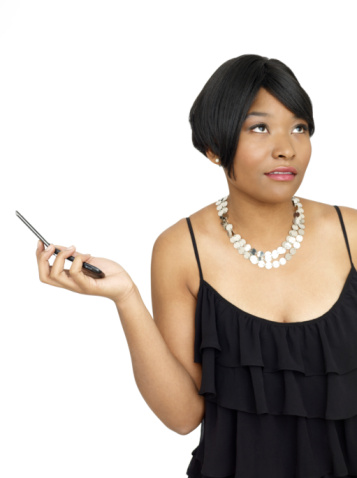 Black woman with cell phone annoyed
