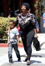 Model Toccara Jones boy Beverly Hills, California on May 26, 2016. black hat, black top leggings Toms shoes. FameFlynet
