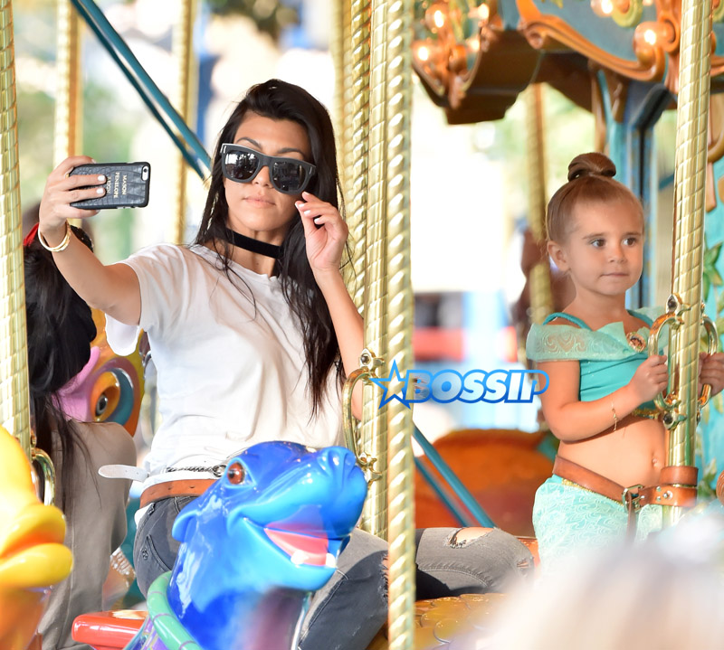 SplashNews Kourtney Kardashian Penelope Disick Disneyland Carousel Selfie