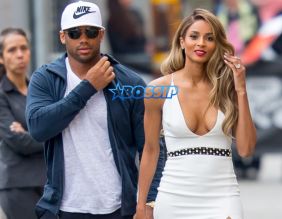 SplashNews Ciara holds hands with fiancee Russell Wilson as they leave Jimmy Kimmel Live! in Hollywood, CA. white dress 16 karat engagement ring