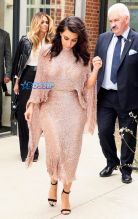 Splash News Kim Kardashian leaving Royal Geographical Society in London with partner, Kanye West, after attending a Conde Nast talk. Carla DiBello