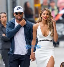 SplashNews Ciara holds hands with fiancee Russell Wilson as they leave Jimmy Kimmel Live! in Hollywood, CA. white dress 16 karat engagement ring