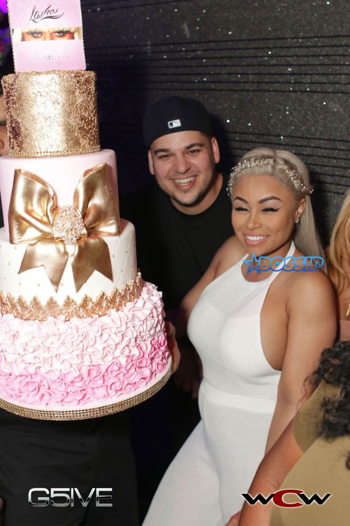 Blac Chyna celebrated her birthday with her fiancÈ Rob Kardashian at G5ive strip club in Miami. The mother-to-be was spotted partying with naked strippers at the club in north Miami alongside her fiancÈ Rob Kardashian. The loved-up pair, were even seen "making it rain" as they hurled wads of cash onto dancers below their balcony. At one point the club wheeled out a huge four tier birthday cake as part of the reality stars festivities. Black Chyna, who was clad in a tight fitting white jump suit, was also seen showing off her engagement ring during the party. The couple arrived at the venue on Wednesday night in a Rolls Royce before leaving at 4am. Pictured: Blac Chyna celebrates her birthday at a Miami strip club Ref: SPL1280685 120516 Picture by: Splash News Splash News and Pictures Los Angeles:310-821-2666 New York:212-619-2666 London:870-934-2666 photodesk@splashnews.com 