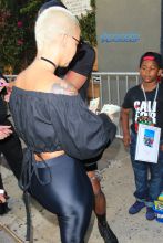 Amber Rose giving a $40 donation Unique Stars Youth Program before her night out. AKM-GSI 5 JUNE 2016