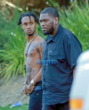 Rapper Slim Jimmy steps out of his limo to pee on the side of the road in Los Angeles, California on June 7, 2016. Slim, who had no shirt on, peed behind a tree. FameFlynet, Inc -
