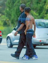 Rapper Slim Jimmy steps out of his limo to pee on the side of the road in Los Angeles, California on June 7, 2016. Slim, who had no shirt on, peed behind a tree. FameFlynet, Inc -