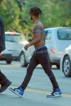 Rapper Slim Jimmy steps out of his limo to pee on the side of the road in Los Angeles, California on June 7, 2016. Slim, who had no shirt on, peed behind a tree. FameFlynet, Inc -