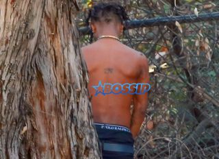 Rapper Slim Jimmy steps out of his limo to pee on the side of the road in Los Angeles, California on June 7, 2016. Slim, who had no shirt on, peed behind a tree. FameFlynet, Inc -