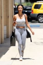 AKM GSI Draya Michele no makeup Barneys gray leggings sneakers tank black crossbody bag braids Barney's shopping bag