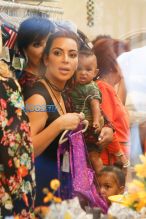 Kim, Kourtney and Khloe Kardashian attend their grandmother Mary Jo Campbell's store opening in San Diego with mother Kris Jenner, Corey Gamble, Scott Disick and their children. Kim carried little Saint as Khloe walked with Nori, Mason and Penelope. AKM-GSI