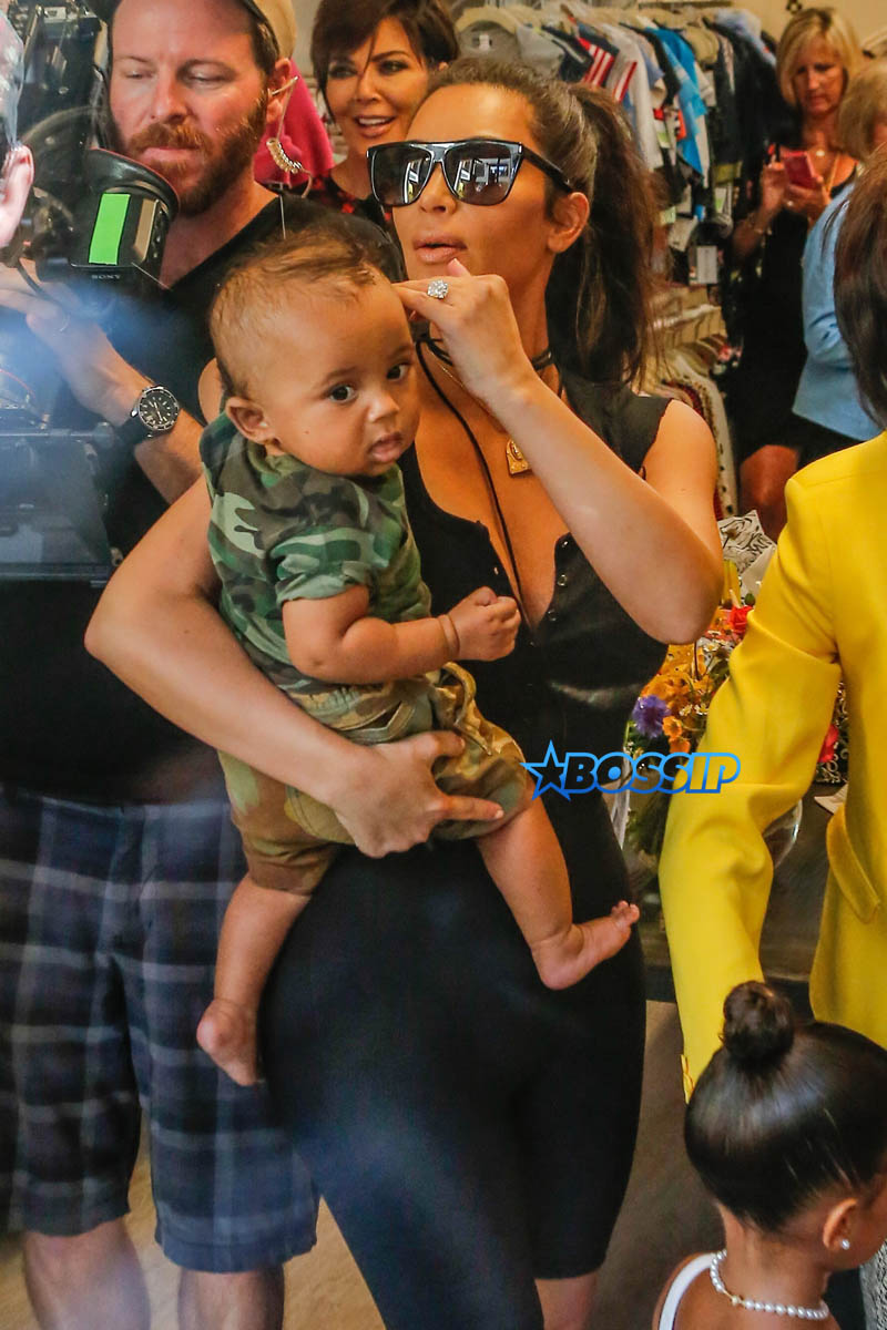 Kim, Kourtney and Khloe Kardashian attend their grandmother Mary Jo Campbell's store opening in San Diego with mother Kris Jenner, Corey Gamble, Scott Disick and their children. Kim carried little Saint as Khloe walked with Nori, Mason and Penelope.   AKM-GSI 