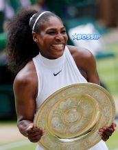 Serena Williams of the U.S holds up the trophy after beating Angelique Kerber of Germany in the women's singles final on day thirteen of the Wimbledon Tennis Championships in London, Saturday, July 9, 2016. (AP Photo/Ben Curtis)