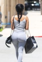 AKM GSI Draya Michele no makeup Barneys gray leggings sneakers tank black crossbody bag braids Barney's shopping bag