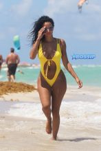 Dallas Cowboys Orlando Scandrick fiance Draya Michele in Miami Beach, FL. cutout bright yellow swimsuit SplashNEws