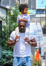 Actor Idris Elba son Winston friend in New York City, New York on July 6, 2016. Winston daddy ride on his shoulders. FameFlynet