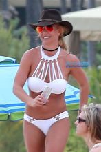 Kauai, HI Britney Spears vacation Hawaii scrappy white bikini, hot pink shorts cowboy hat toned body beach kids played sand FameFlynet/AKM-GSI