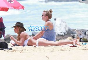 Kauai, HI Britney Spears vacation Hawaii scrappy white bikini, hot pink shorts cowboy hat toned body beach kids played sand FameFlynet/AKM-GSI