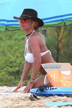 Kauai, HI Britney Spears vacation Hawaii scrappy white bikini, hot pink shorts cowboy hat toned body beach kids played sand FameFlynet/AKM-GSI